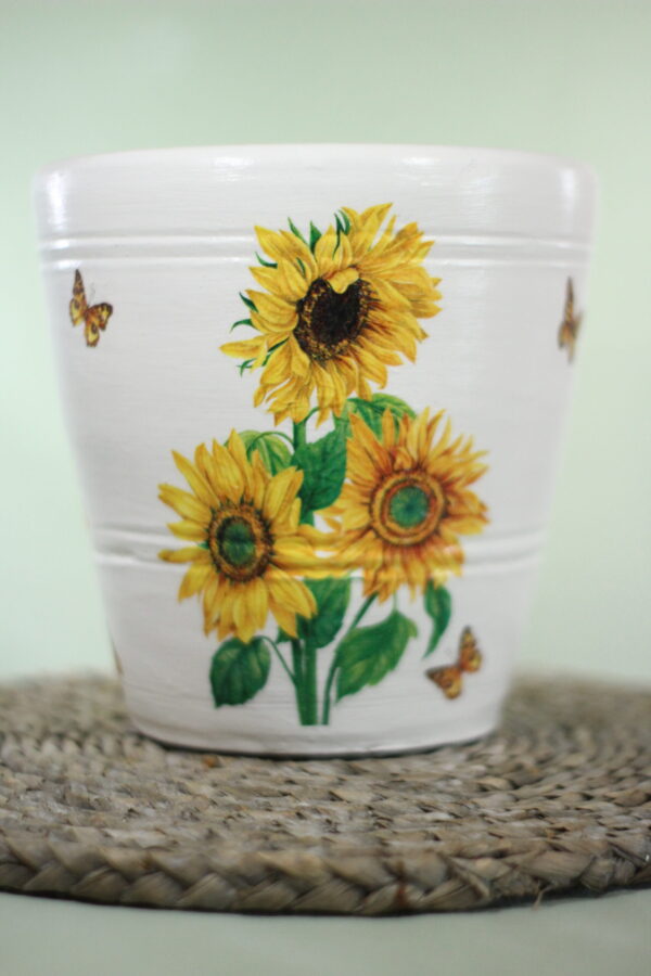 White terracotta plant pot with hand-painted sunflower and butterfly design – decorative indoor flower pot for home or garden décor.