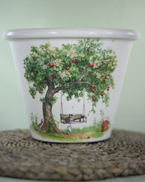 garden pot with apple tree and swing, green background