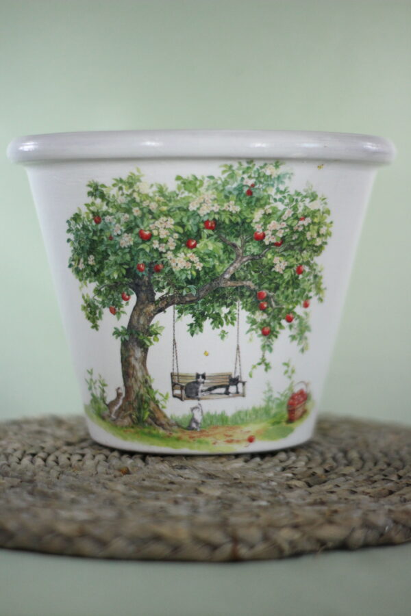 garden pot with apple tree and swing, green background