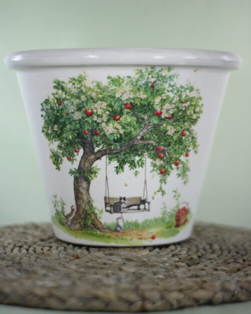 garden pot with apple tree and swing, green background