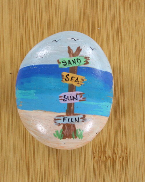 seaside beach painted onto a pebble