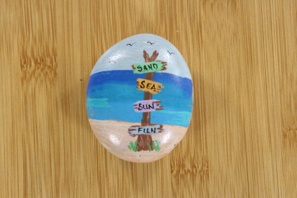 seaside beach painted onto a pebble