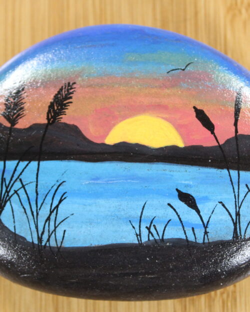 pebble painted with sunset