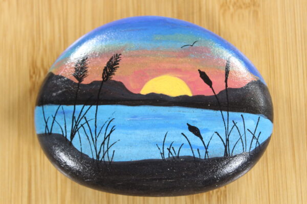 pebble painted with sunset