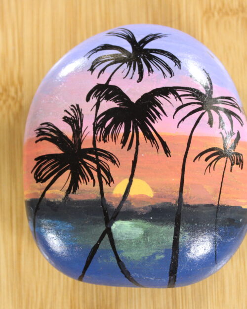 sunset with palm trees painted pebble