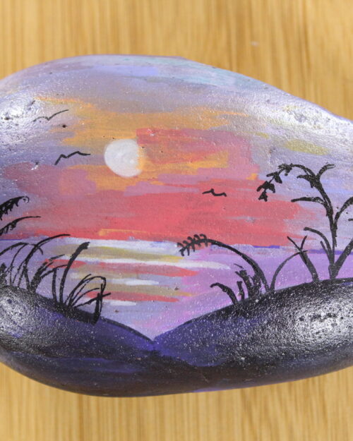 sunset, purple painted pebble