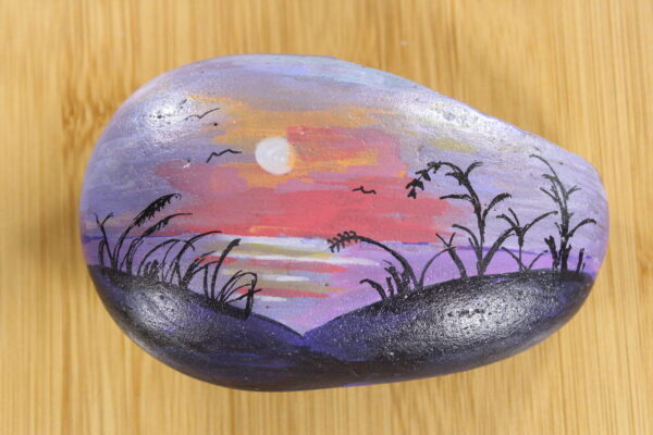 sunset, purple painted pebble