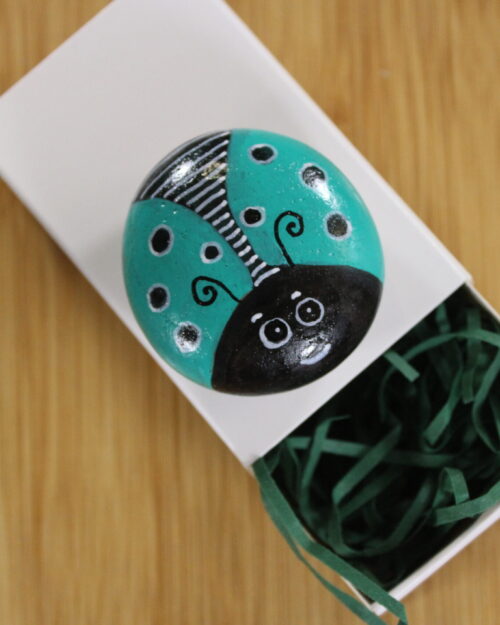 light blue painted pebble - pebble pet