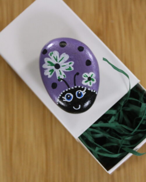 purple and flowers painted pebble - pebble pet