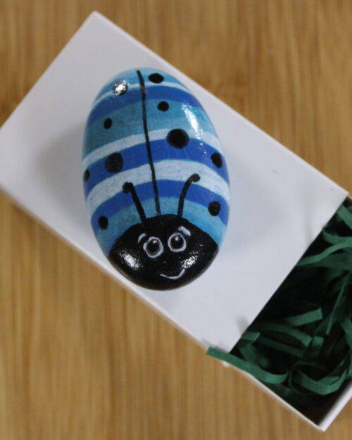 blue and white striped painted pebble bug - pebble pet
